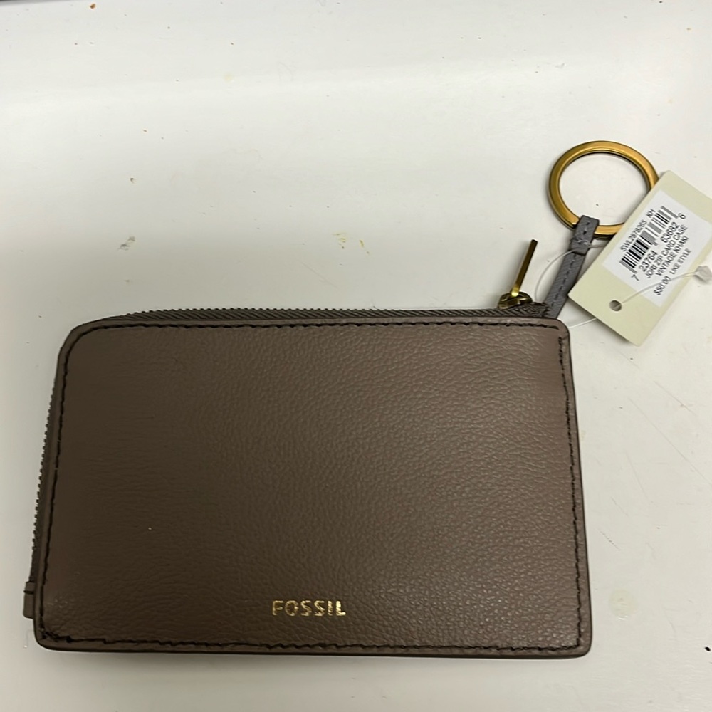 Fossil zip card case, approximately 6”x4”.